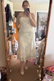 So I purchased this dress on a whim for my bridal shower. I went back and forth, quadruple-checking my measurements to make sure this would fit, and I looked stunning! I got so many compliments and the dress just moves so beautifully. And it steams so well! It was very comfortable, not see through. It was heavy but breathable, and I think I'm going to have to wear it for my rehearsal dinner as well because it is just so good! I love this dress. It is so elegant and cute, so bridal but you could also wear it outside of a bridal event if you wanted to. It fits so well. I ate so much food and it just fit so nicely. I didn't feel like I changed much, as I bloated, and it was very comfortable. The top stayed up very well. I did wear a strapless bra underneath if that helps anyone. But I am just in love with this dress. What a special dress for a special day. I can't wait to wear it again! - Alyssa S.