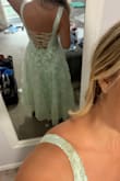 I ordered six dress options for my brother's wedding and my family and I voted that this was the winner! Love the adjustable corset back and the POCKETS! I can keep my phone and lipgloss with me all day. Love the light sage green color, how fitted and smooth the top is and the option for no bra. The bottom poofed out in a flattering way and I'm going to pair it with gold shoes and jewelry. So excited I found this dress! - Bluey B.