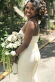 I've tried on dresses at all the boutiques and still this was my favorite! High quality and true to size. Perfect for an elopement! Modest but accentuates the shape. Pretty lace, and didn't need to be tailored when paired with a 4 inch heel. Added a bridal sash and felt like a million bucks! - Ashley-briA M.