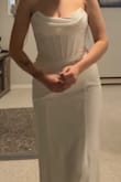 I absolutely loved the style of this dress & it's definitely beautiful! The Bodice & corset is beautiful. I found the waist & hips to fit very nicely but the bust to be quite loose, even with the corset back tied as tight as it would let me! It did show slight cellulite through the butt area which I didn't love (due to the thinner fabric there) but overall a nice dress for the price! Just wasn't "the one". - Breanna D.