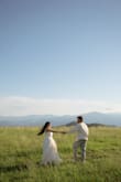 I brought this dress on my mountain (yep, mountain!) vacation trip because you just never know when or where you could get engaged lol. My boyfriend took me on a mountain hike showing 360° views of Tennessee and North Carolina all around. Then he got down on one knee. He surprised me by having our photographer bring my dress with her so I could change into it for our engagement shoot. Naturally, it was a little long and hard to run in on a grassy mountain patch, but it still felt perfect on me. Straps fell at times while photographing but nothing unmanageable. I've gotten so many compliments on the dress specifically from family members and friends who've seen our pictures. I truly felt like a princess wearing this dress. - Christina M.