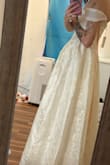 This dress is absolutely stunning! I picked this as my wedding dress and couldn't be happier. I expect to do some hemming, as I am very flat-chested and the top does not hold up on me, so I will need to get the bodice taken in. But length-wise, I am 5'3 and in 3-inch heels, and the dress just sweeps the floor. It's perfect! I ordered an XXS! The sleeves need to be taken in, but I am very small, so I expected to have to get it hemmed! - Skye P.
