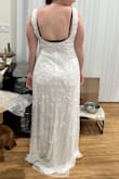 Well made gown. A bit heavy from the beads but the straps are comfy. Wish it hugged my curves a bit tighter but overall a great gown. Wearing for my rehearsal dinner. - Meg M.