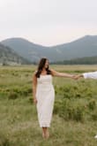 This dress was beautiful! Bought for a photo session. 
It has a liner, so it was not see thru. It is a thicker material. 
The straps did fall off some but wasn't deal breaker. - Brittany S.