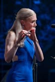 The dress is lovely. I had the opportunity to wear it for a professional engagement (concerto performance; professional flute player) and received so many compliments. It fits on the tighter side, but that is how I prefer my garments to be. Absolutely looking forward to wearing it again!! - Kathryn F.