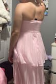 Honestly, I read a lot of the reviews about this dress and many people said this dress runs small. It does, in fact, run very small - I am someone who wears a size XS & I ordered the dress in a Medium. Thankfully, with assistance, I was able to zip up the dress. The zipper is a bit finicky, and again, if you have a larger chest, it's a gamble bc it was very snug with no give. The dress, overall, aside from the top part is very pretty/flowy & I love the color. If you really read the reviews in depth, I would recommend ordering the dress! I am wearing it for a friend's wedding as a bridesmaid. If you're looking to order this dress, my suggestion would be to order 2 sizes up if you have a larger chest and follow the bust guide over the waist and other measurements. - Kimberly L.