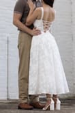 It took me FOREVER to find a dress for my engagement photoshoot, and I'm so glad I went with this one!! I love the back, and the silhouette was exactly what I was looking for. I was hoping it would be more tea-length, as I didn't have time for alterations before the photoshoot nor the budget (the dress has 3 layers so it would've been expensive!). Although I just attribute that to me being so short lol. Overall, I love how my photos came out, and I will be reusing the dress for my rehearsal dinner! - Jaeden T.