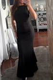 I bought this dress along with another one for a wedding, planning to return whichever I didn't choose - but I ended up keeping both because I loved them so much. This dress turned out beautifully and fit like a glove. My only minor complaint is that you have to keep pulling the back down a bit to keep the side straps from gapping, although I think that's just how it's designed to sit. The material is much thicker than I expected but very high-quality and flattering. The open back is absolutely stunning. I have a more athletic/triangle top body shape and usually I want to hide my back, but this compliments it well. I'm also a sucker for a high neck dress. For reference, I'm 5'4 about 128 lbs. I did have to have it hemmed as it was still too long on me with 4-inch heels. Overall, it's a gorgeous dress and I'm so glad I kept it as so many of my friends are getting married! - Gianna C.