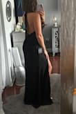 I am absolutely obsessed with this dress! It's lightweight, comfortable, and perfect for a summer wedding. I'm a sucker for a high neckline and a slit, and the open back makes it even more stunning. I originally bought this dress along with another one, planning to return one, but I ended up keeping both because I loved them so much. My only complaint is the length. Even with 4-inch heels it was still too long, so I had to have it hemmed (pictures are from before hemming). For reference, I'm 5'4, 128 lbs, and have a more athletic, triangle-shaped upper body. Overall, it's a gorgeous, elegant dress that fits beautifully, and I'm so excited to wear it as a wedding guest to a black-tie wedding! - Gianna C.