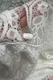 I really love this dress, but when I received it, it had a hole in it before I tried it on. I originally ordered a medium and then exchanged it for a small. By the time I tried it on, I wasn't able to return or exchange it again. I'm super bummed because I love this dress and it looks great on, but I can't wear it to my bachelorette party now. - Michelle