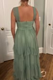 I liked the dress, but it looked darker than in the photos on the website. It was pretty long, would have had to hem it even with heels. I ended up returning it. It's very shimmery, mermaid vibes for sure. Also there was a small snag on the outer layer. - Melanie C.