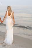 I bought this dress for my engagement photos and was pleasantly surprised. I'm not a fan of satin, but this dress was absolutely stunning and fit so beautifully!! I received so many compliments. It does wrinkle and is not a true white, but despite that, it was the most perfect dress! - Daria S.