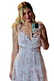 This dress is absolutely stunning! The fabric is soft, lightweight, and flows beautifully. The floral print is even prettier in person, and the layered tulle gives it such a romantic, ethereal look. The wrap-style bodice is very flattering, and the adjustable shoulder ties add a feminine touch while allowing for a better fit. It's comfortable to wear and perfect for weddings, garden parties, or any special occasion. I received so many compliments and felt beautiful wearing it. Highly recommend! - Ariel K.