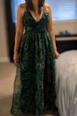 I have a pear-shaped body. My bust is 34C, waist is 31 inches, and a large fit me like a glove. I normally wear a medium top, 8/10 bottom. I'm 5'8", with a short torso and longer legs (33" inseam). The length was great, even with heels. The bottom is flowy, so it easily fit my wider hips at 41 inches, but it did make me look wide due to the puffy nature of the fabric. Ultimately, I chose a more form fitting dress over this one that made my body look more proportional. No complaints about quality. - Cassandra K.