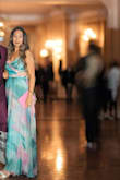 The material was flowy and light and had a slip underneath for any coverage. The bust area fit great. I got compliments all night from the hotel to the venue. I am pretty tall (5ft11) and wore 2 inch heels and it was floor length. - Catherine A.