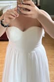 Bought this with a few other options. I thought it was pretty (lace detail under the tulle was a nice touch), but the proportions just seemed weird. The torso seemed really short, and the top was not at all flattering (made me seem a lot wider because of where the waist fell). Maybe I just don't have the right body type for this style. - Stephanie R.