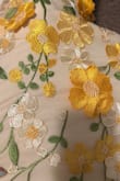 I debated buying this dress for so long as I never usually wear yellow, but I am SO glad I did!! The material is good quality, and the flowers don't look cheap at all; they are really soft. I'm 5'6 and it was touching the ground without heels. - Miranda H.