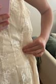 I love the look of this dress however the sizing seems off to me. The medium was way too big around the chest and torso. There was way too much space around the waist. Hopefully sizing down does the trick! - Lyla I.