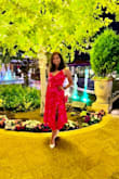 Absolutely stunning dress!

I wore this dress for a girls night and received so many compliments! The color is even more vibrant in person, a gorgeous, eye-catching pink/red that photographs beautifully. The pleated skirt gives it such an elegant flow, and the front slit adds just the right amount of sophistication without being too revealing. I paired it with white pointed-toe heels, and it looked effortlessly chic. 

If you're looking for a dress that's feminine, flattering, and perfect for date nights, weddings, vacations, or summer events, I highly recommend this one! It made me feel confident and elegant. - Shobhana S.