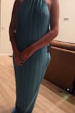 This dress is sewn incorrectly. The liner got partially sewn into the dress seam just above the slit and it bunches and will not lay normally. Looks terrible because of that. The color and fabric are otherwise beautiful and I'm sad I wasted my money on the dress and cannot wear it. - Abigail L.