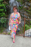 I can't express how much I love this dress! It fits perfectly on a curvy shape with a soft tummy, and doesn't hug in the wrong places. I danced all night with zero sweat marks. The back is dropped to the perfect spot and the big tie in the back is so cute. Great length for a small heel too! - Amber T.