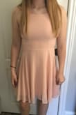 Dress was exactly what I wanted. Colour was true to pics, fits perfectly.  Back is adjustable so you can tighten or loosen as needed. Quality of material and stitching is excellent. Can't wait to wear it to my grad! - Jennifer C.