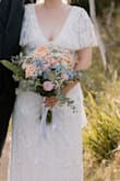 Loved this as my wedding dress, fit perfectly. Was slightly heavy with all the beading. I found every single time I tried it on, even though I was super gentle, about 15 or more of the white sequins would just fall off the dress. They don't seem to be attached very securely. - Grace N.