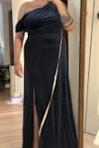 There was a big hole along the seam. It didn't look ripped. It seemed like they just stopped sewing. I didn't love the dress, but I would have made do since I needed it for a wedding a week from now. However, considering the price I'm not paying to hem AND fix what never should have been broken. Otherwise, the fabric feels nice. It doesn't look all that expensive but not terribly cheap either. The top was very flattering and fit my larger chest well. I didn't feel like I'd have to worry about anything slipping out. I liked the slit. I'd say it's tastefully high, but I do have a short torso. I would have preferred a looser waist since I have a rounder stomach, but it fit comfortably at least. - Mollie R.