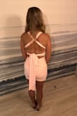 The dress fit well but was a little tight.  I might have gone up a size so I didn't feel like I had to pull it down if I walked a lot.  I ordered a small but if I had time to return and exchange, I would have gone for a medium. - Samantha K.