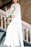 It fit perfectly and didn't have to get it altered at all! The quality of the material was great for the price, and it photographed well!! Easy to move in. Got a ton of compliments on my dress! Wore it all day for my civil ceremony at the courthouse. Wore it with some shorter kitten heels. - Brenna S.