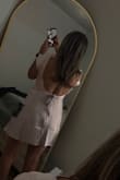 This dress is super cute and perfect for a vacation! I love the color, fit, and open back. It does run a little snug on me, especially around the waist and hips, so I probably should have sized up. It's also a little shorter than I expected, but overall it still fits well and looks really flattering. It felt a little off when I first put it on, but once I styled it, I really liked it. Definitely keeping it for my trip! - Carolina H.