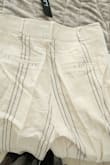 The pants in the photos are shown with well-lined horizontal lines. In reality, the lines are all over the place. The material is nice though. - Elena W.