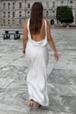 Bought this dress for my legal ceremony. I'm having a destination wedding, so I just wanted something cute but inexpensive for the civil ceremony. This dress definitely did its job, but I wouldn't buy it again. It's not see through which was perfect, I didn't need to wear a bra with it. But the fabric gets very wrinkly after sitting and moving in it throughout the day which showed up in pictures. The slip underneath also got bunched up a few times, which causes me to have to pull it down to fix it. The dress also didn't fit the best, the way the sleeves are designed when I bent forward the entire top of the dress fell right off of me. It's a beautiful dress, but cheaply made. - Samantha V.