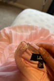 This dress is beautiful but came to me with the clasp at the top of the zipper missing. I have difficulty finding dresses that fit me, especially lengthwise, and I have unfortunately had bad experiences with Lulu's, with other dresses arriving in poor quality so I am willing to bite the bullet and deal with this faulty dress to avoid the possibility of exchanging it for a dress in worse condition. - Tabbatha S.