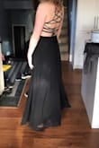 I bought this dress in a medium originally, had to do an exchange for the small because the chest was too big. I think if the back wasn't open and adjustable it would have been too snug, but the fact that it can adjust with the strappy back, you can definitely get away with sizing down. The waist band is elastic, so its forgiving. I found the medium was gape-y in the chest, so if you are small chested I would suggest sizing down! If you are any bigger than a B or small C, you'd need a medium.
I normally wear a size 4-6 jean.
I am 5'8 and wont have to get it hemmed, so if you are taller keep that in mind... - Brenna H.
