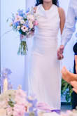 Bought this dress for my reception and it was perfect!
I am a little short (5'2), so I had to take a little bit off the bottom so I wouldn't trip on the dress. We also tucked the straps on the back of the dress because that's where it was a little big, but that was no problem! Adjusting the back straps also helped the neck area to sit better than it was at first, so pulling those in just a little was perfect!
Overall, even with the alterations, it was the perfect dress and great quality for the price! - Ariel H.