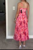 I wish both the dress bust and the zipper were not crooked. It was revealing, but I knew that when I bought it. The pleating is nice and stiff with thick chiffon. The color was very vibrant. I did not know it was a final sale, or I wouldn't have bought it. - Lacey J.