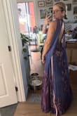 The neck is super tight, and the bust is tight in weird areas, but the rest of the dress is loose. I feel like it would look amazing on someone petite with a flat chest. - Jaden J.