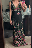 This dress is beautiful, with quality embroidery and tailoring. However, there are a lot of loose threads that I had to cut off, some of which I can't get to because of the way it's sewn. I also had to size down because my normal size was too large. Like others stated, there also doesn't seem to be any consistency in how the pattern is arranged on the dress. I ordered two, and one had the flower grouping right over my stomach. I liked the off-center one better and kept it. - Melissa M.