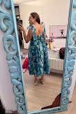 I almost kept this, but there were weird cut-outs in the bust area that didn't make sense, and I wound up keeping two others instead. I tried the size M (I'm usually a M), and it wouldn't zip. The L zipped perfectly, but the bust seemed a bit big (I'm a 36DD for reference). - Amanda P.
