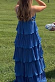 I loved the material and felt so comfortable dancing in this all night. One of the straps did appear partially ripped when the dress came, but it thankfully did not break after a night of dancing. - Teagan H.