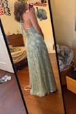 This dress is so cute and flattering. I love how the corset is adjustable. - Madison S.