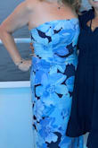 Loved this dress. Perfect fit. I bought a medium. I did find it a little loose on top, but it does have that sticky tape holder on it. I danced in it all night and never had an issue. I love the cut out on the back- it's a sexy detail. And the waste cut perfectly to hide my belly. Which I hate. I'd recommend. - Colleen W.