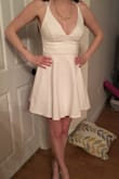 This dress is perfect for my bachelorette party. It's classy, but sexy at the same time. There is a tight layer underneath that is good because if you are spinning around dancing, it won't come up. The material is sturdy and not see through at all. No need to wear a bra! - Carly A.