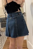 Simple and cute. Waist doesn't have stretch so I'm glad I went with the medium. The small would not have fit me. The only thing I don't love is how long the zipper is on the front. It kind of bunches a little and is very prominent. Worth it overall for the sale price. - Holly R.