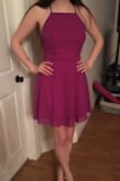 I like this dress a lot, but the fit was a little strange for me. I found it a little loose in the chest, so I had to tighten the straps a lot, which made the back ride up slightly. Other than that, I love it. The color is gorgeous and really different. It's not too short either and I was worried about that. - Carly A.