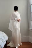 It has been extremely difficult to find a wedding dress that doesn't have a super deep neckline, isn't backless, is long enough for 5'8 (including heels), AND budget friendly. But this dress checked off all of those! I'm excited to wear this to our civil ceremony :) I did read about the wrinkles in the other reviews, and I can confirm that they do wrinkle easily (just putting the dress on at home wrinkled it), but I think I can work with it at the city hall; I'll just bring a steamer. - Suji I.