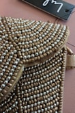 I bought this clutch for a wedding and was extremely disappointed in the quality for the price. It feels like the fabric was glued together, and you can even see some glue marks on the front. It was even damaged on the inside, with pucker marks in the fabric. Lulus has always had good products, but my last few purchases (especially this one) have fallen short. - Carly V.