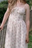 This is my favorite dress I've ever owned! I am a tall girl (5'9"), so the waist hits higher than it's supposed to. (But that is true for all dresses on me) Also, the waist feels a teeny tiny bit loose on me, but I don't mind, and it's still beautiful. When it arrived, the ends of the lace bow were not even, so I just cut and stitched one end. Regardless, I love wearing it, and it was perfect for my trip to Italy and photoshoot! It has a beautifully full skirt and passes the twirl test. I had to get it in both colors, and the flower details are stunning on both! - Jillian L.