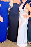 Absolutely love this dress. It's true to size and has a thicker fabric, so it doesn't feel cheap. The ruching in the midsection makes it very flattering, and the top of the dress has wiring in it that you can bend to make it sit flat against your chest. - Melissa B.